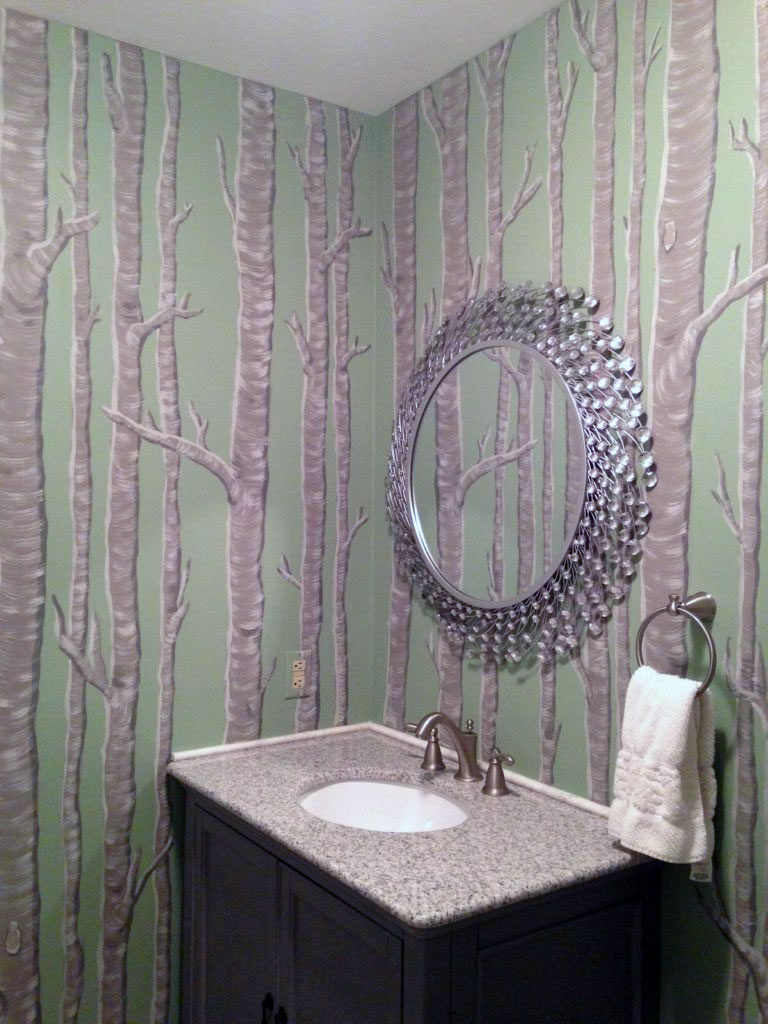 Birch tree mural painted throughout this powder room.