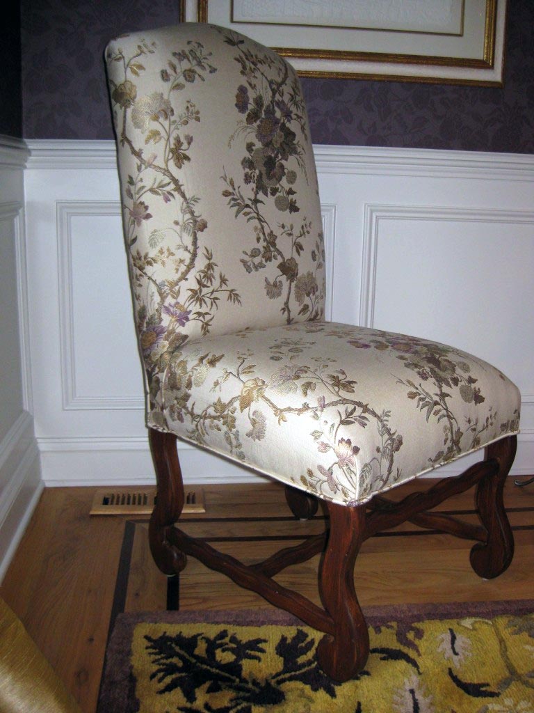 Blond wood dining chairs refinished to replicate mahogany.