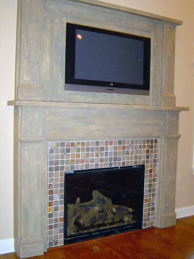 Newly constructed fireplace mantle painted with a multi-layer distressed finish.