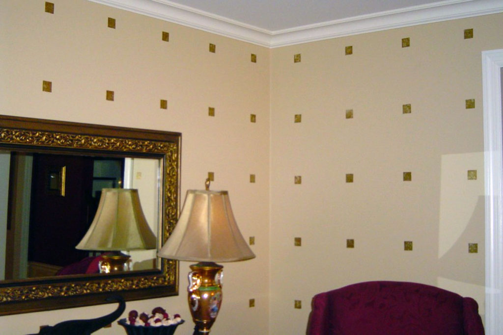 Gold leaf squares in graphic pattern on Living Room walls.