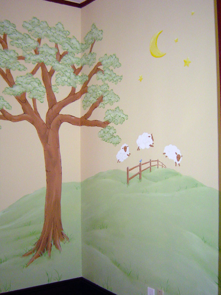 Nursery mural featuring sheep jumping fence.