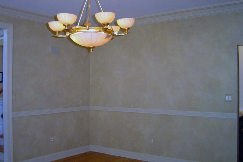 Living room walls painted with three-color blended paint finish.