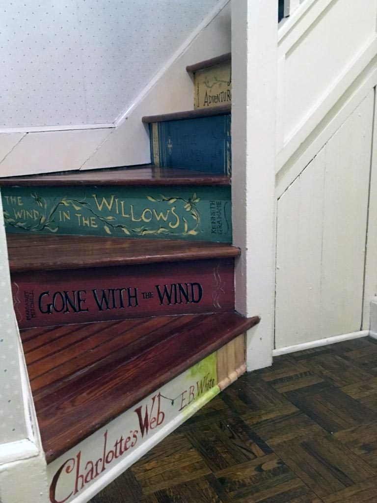 One classic book painted on each stair riser in this reading nook.