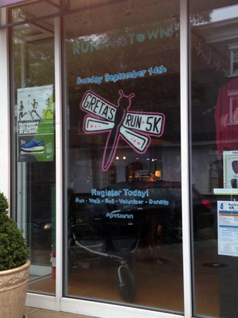 Storefront window design for run event.