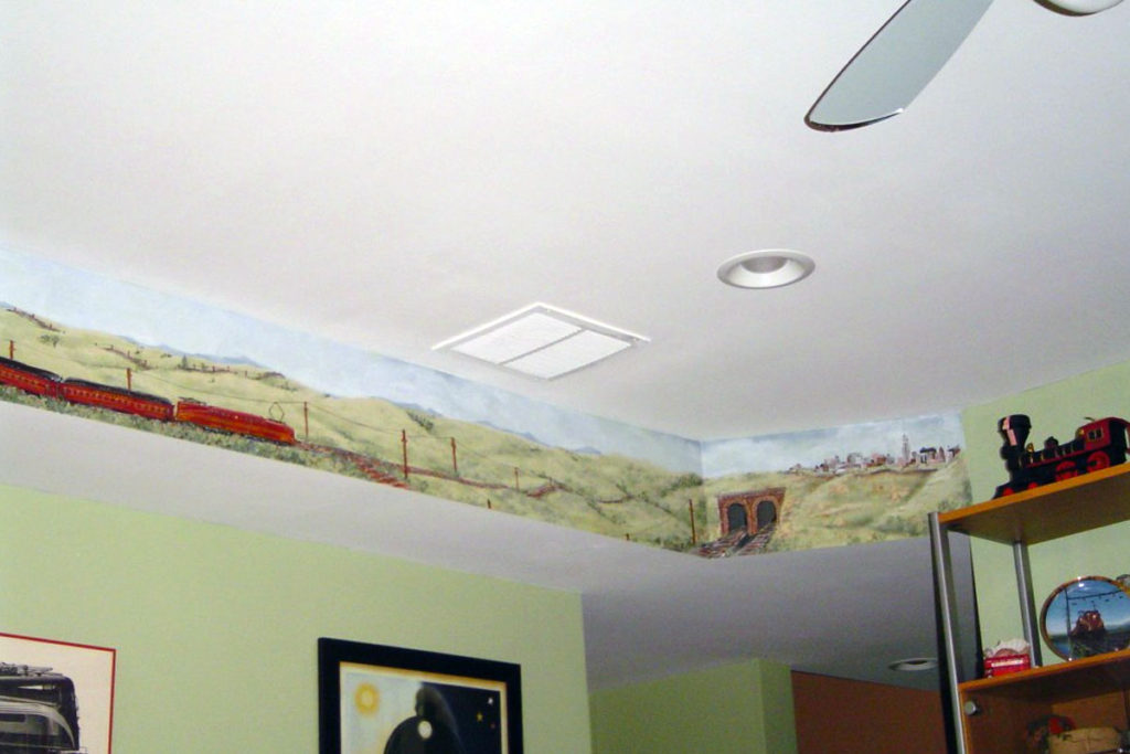 Detail from vintage train mural along soffit in Family Room.