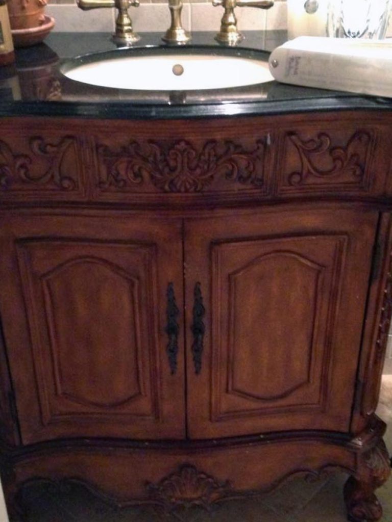Before: French carved wood vanity in its original wood tones. Pretty, but could use an update.