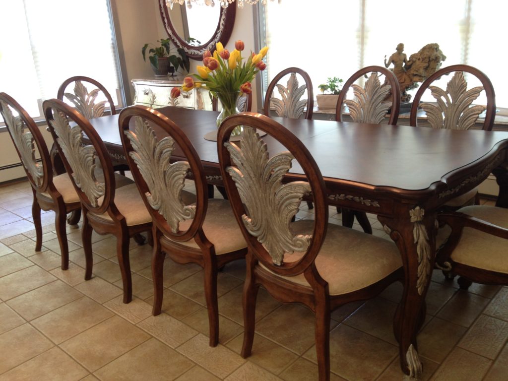 Silver accents painted on dining room tables and chairs.