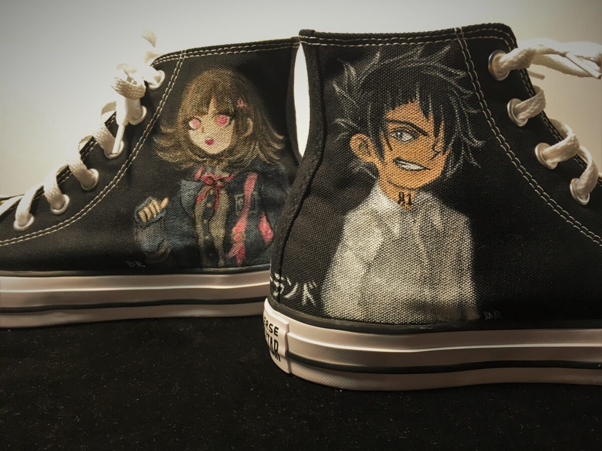 Anime characters painted on hi-top sneakers.
