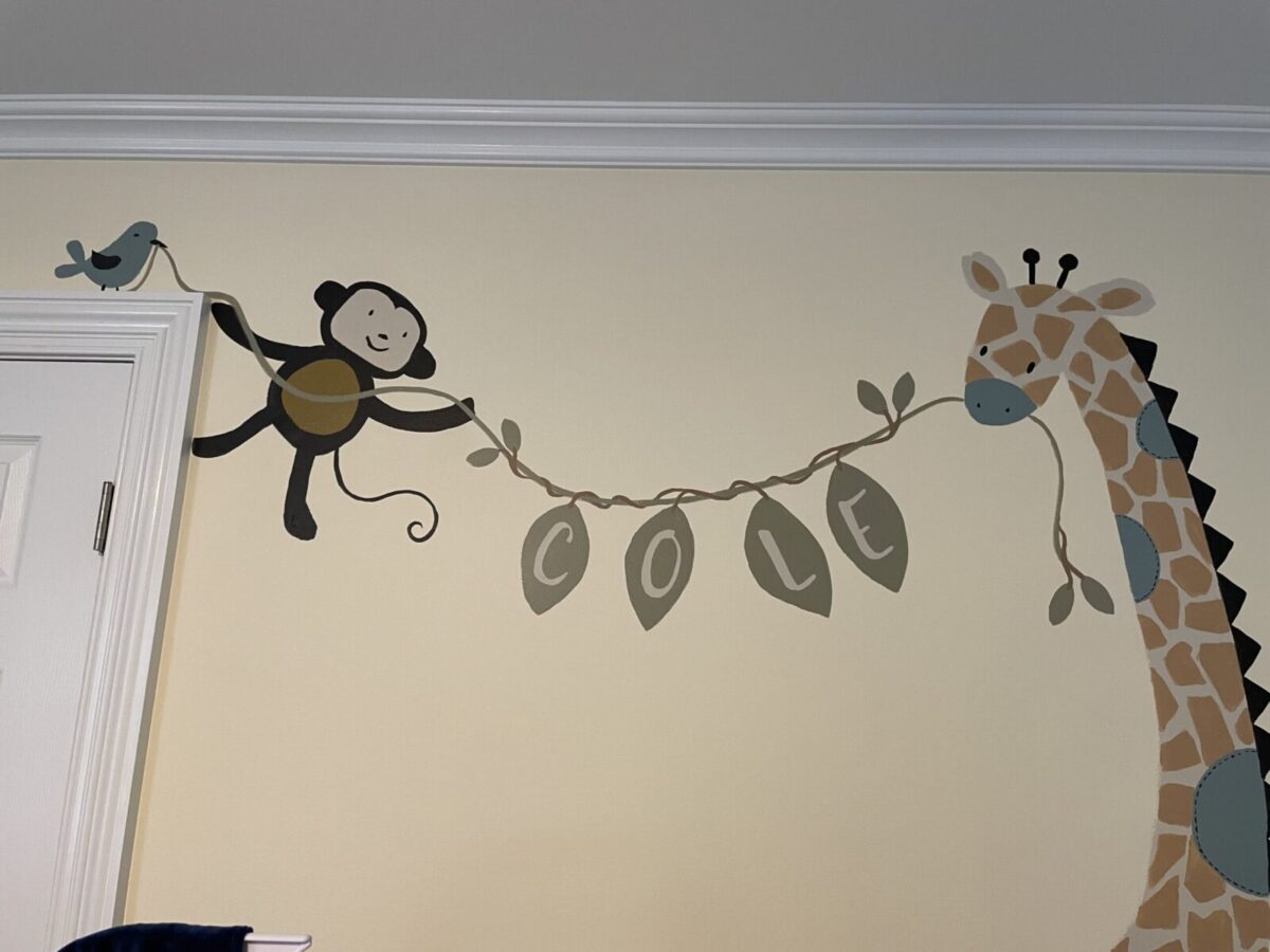 Baby's name added to mural above the crib