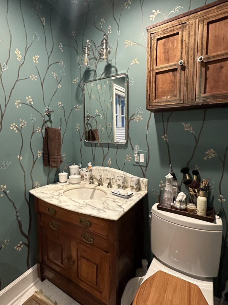 Stylized branches and buds painted in bathroom.