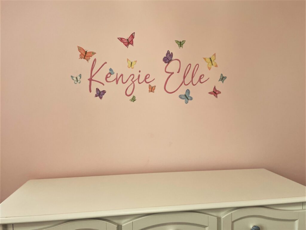 Name and butterflies painted in nursery