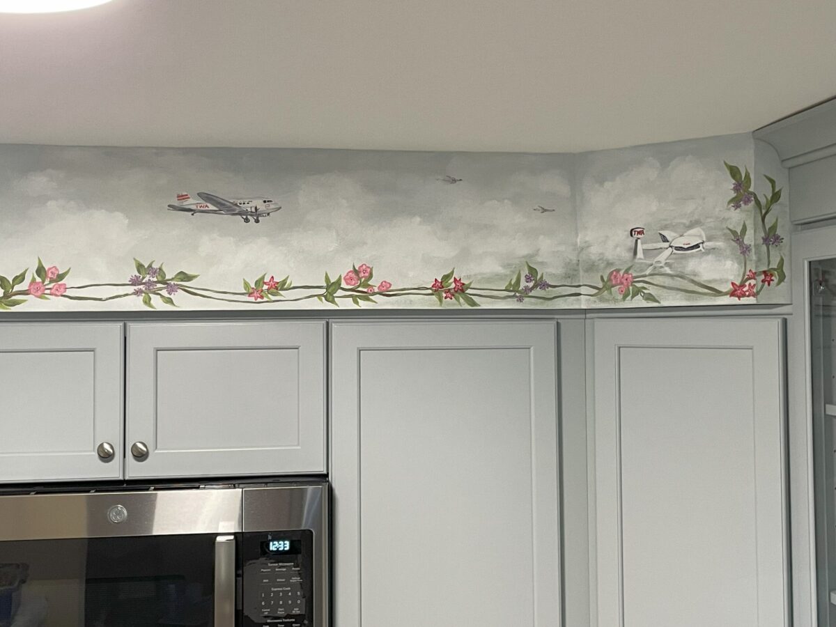 Kitchen soffit painted with airplanes and airport terminal